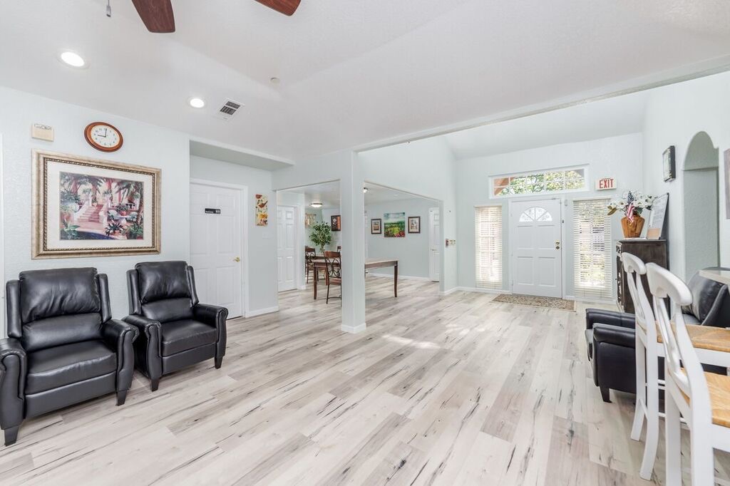 Bright entryway with an open lounge and dining space